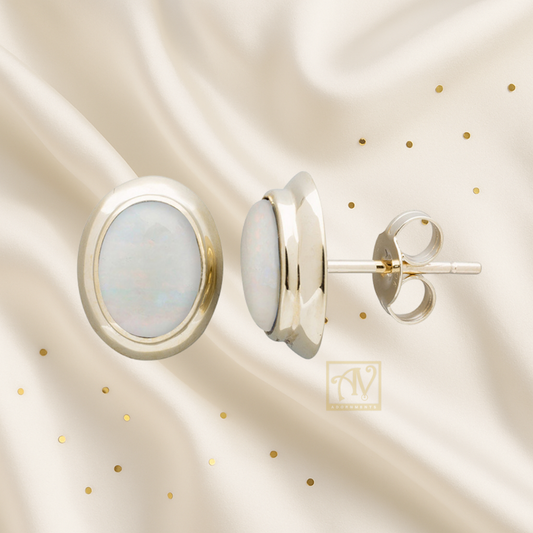 Ivory Oval Solid Opal Stud Earrings 9 kt Yellow Gold